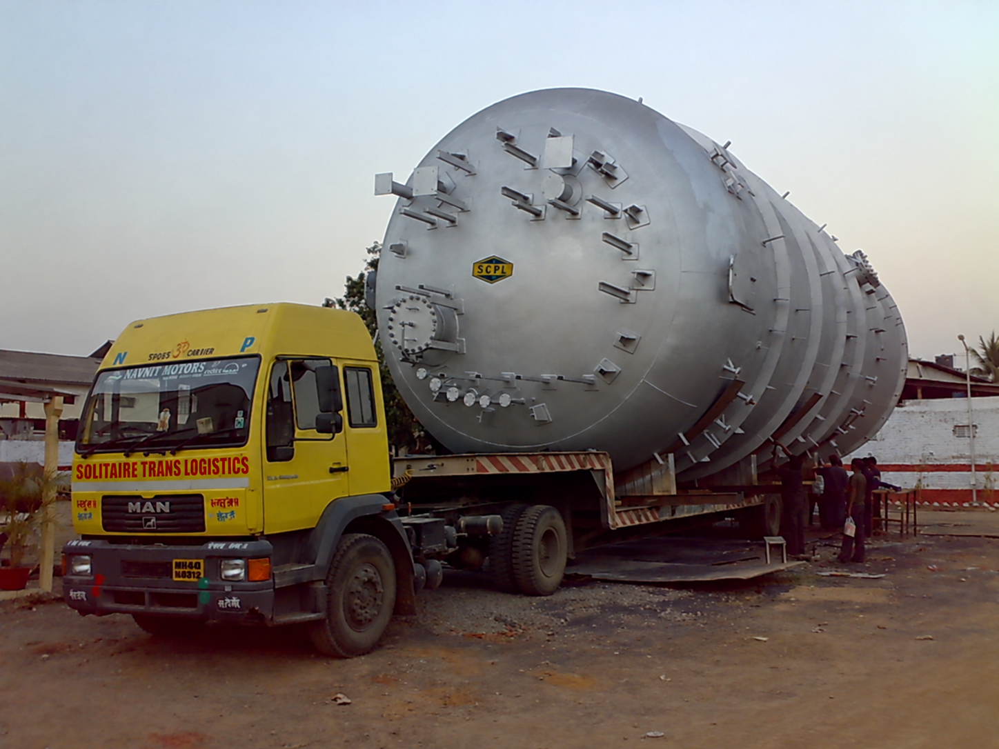 Large tank moving as ODC cargo on a low-bed trailer